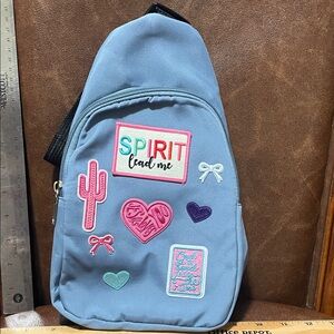 Blue Backpack with Colorful Patches